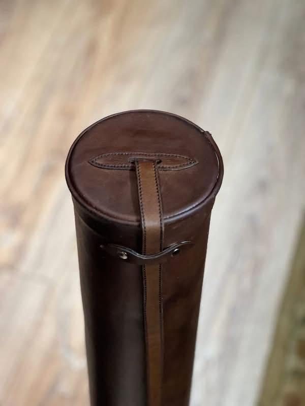 Leather case with hand-stitched monogram