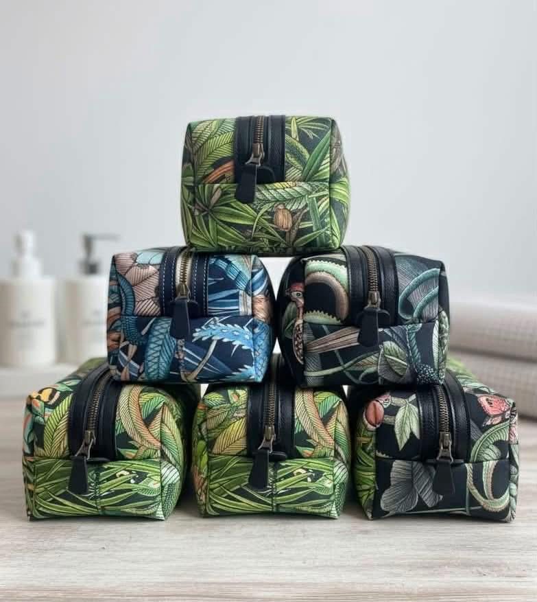 Botanical-print Dopp kits stacked