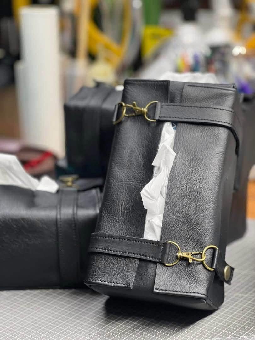Close-up of a black leather bag on the workbench