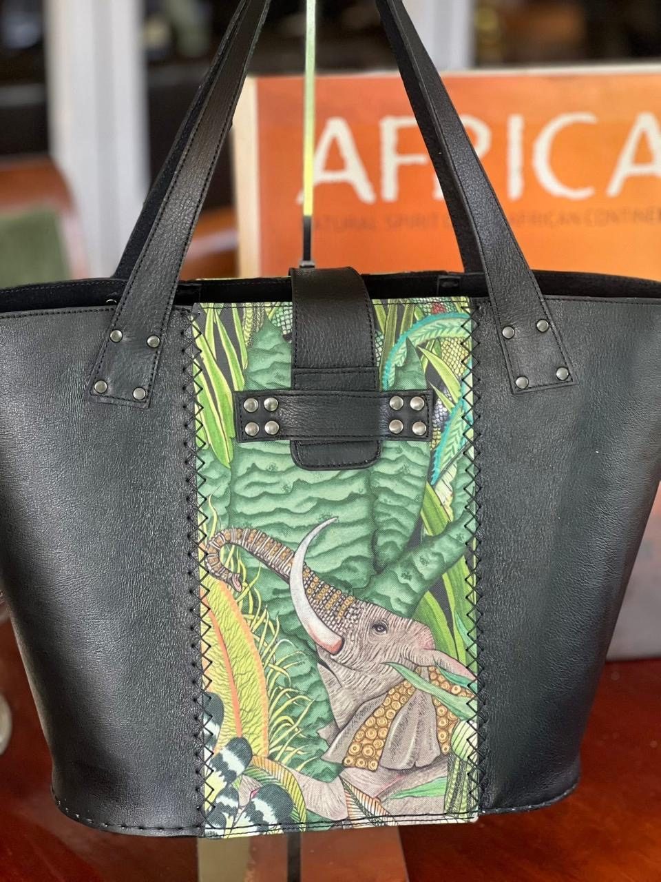 Black leather tote with green elephant panel