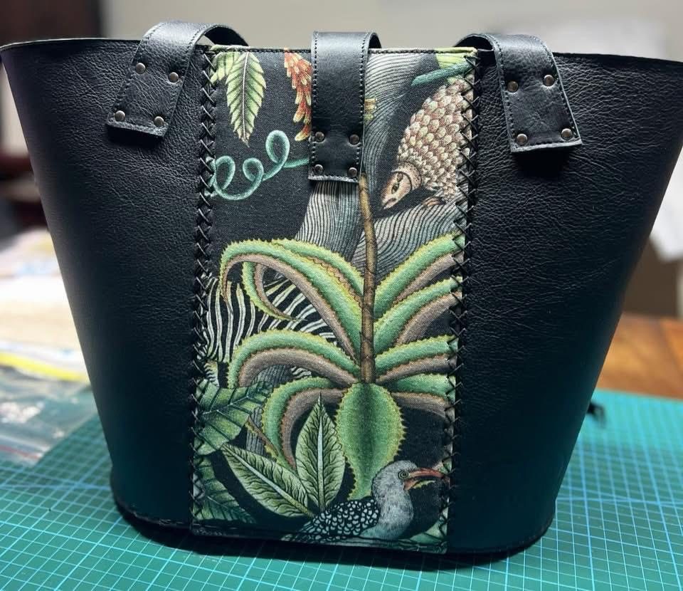 Black leather tote with hornbill and aloe panel