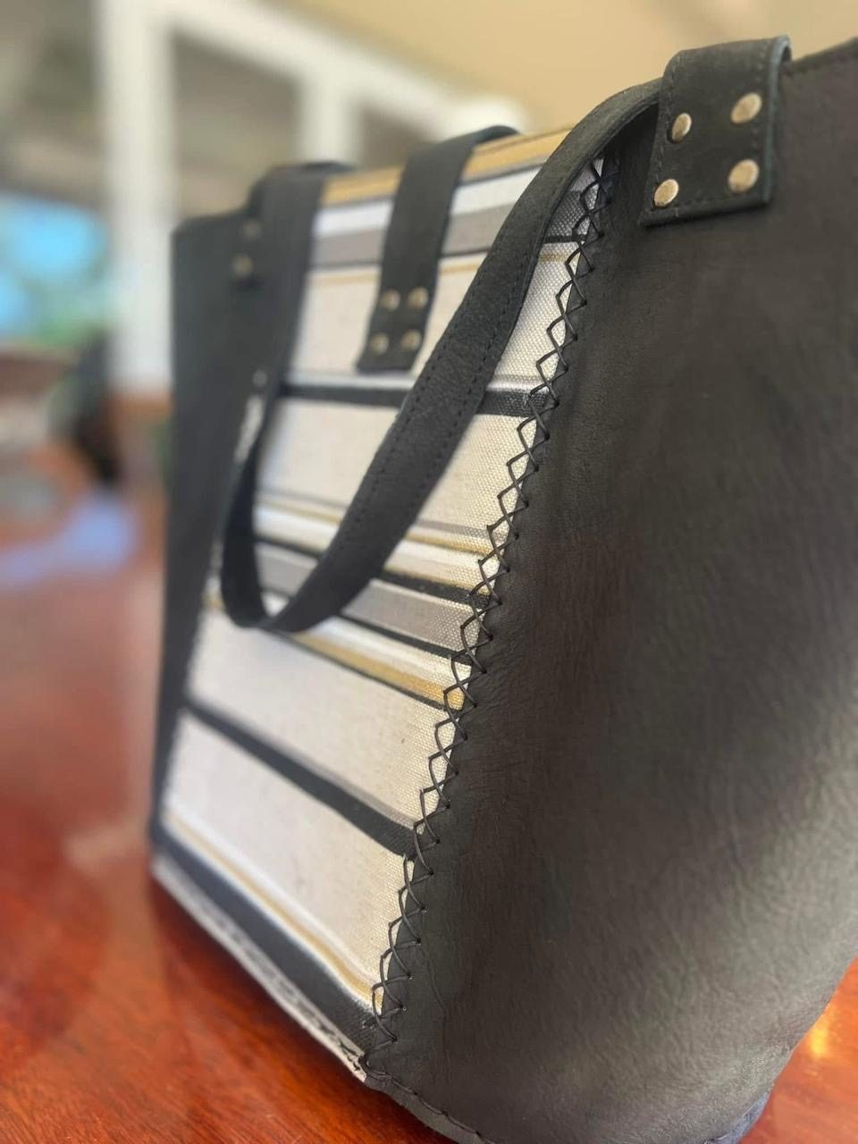 Close-up of a striped fabric panel on a black tote