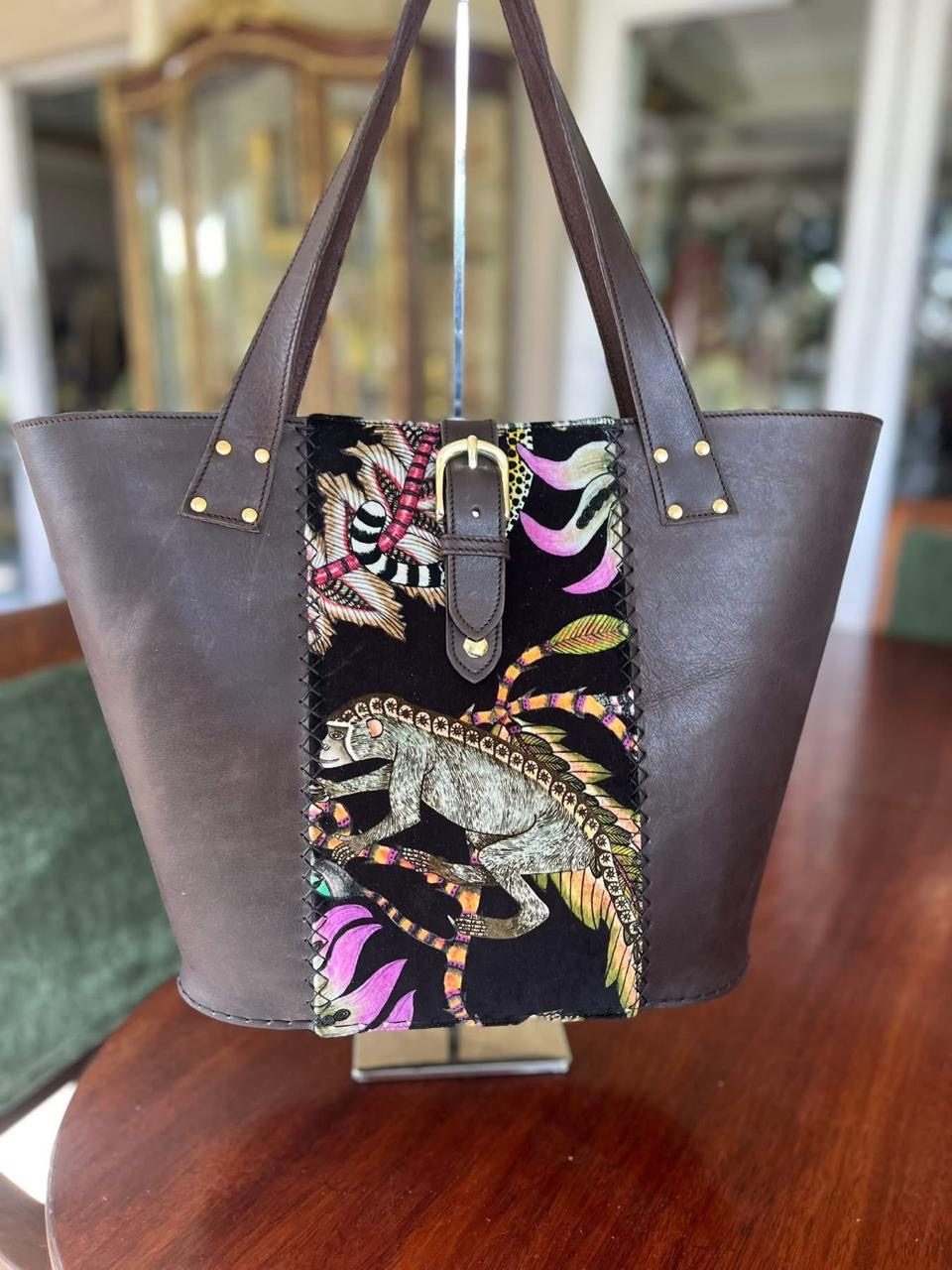 Brown leather tote with monkey tapestry panel