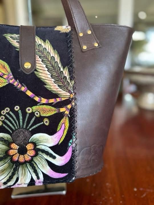 Hand-stitched floral tapestry panel, close-up