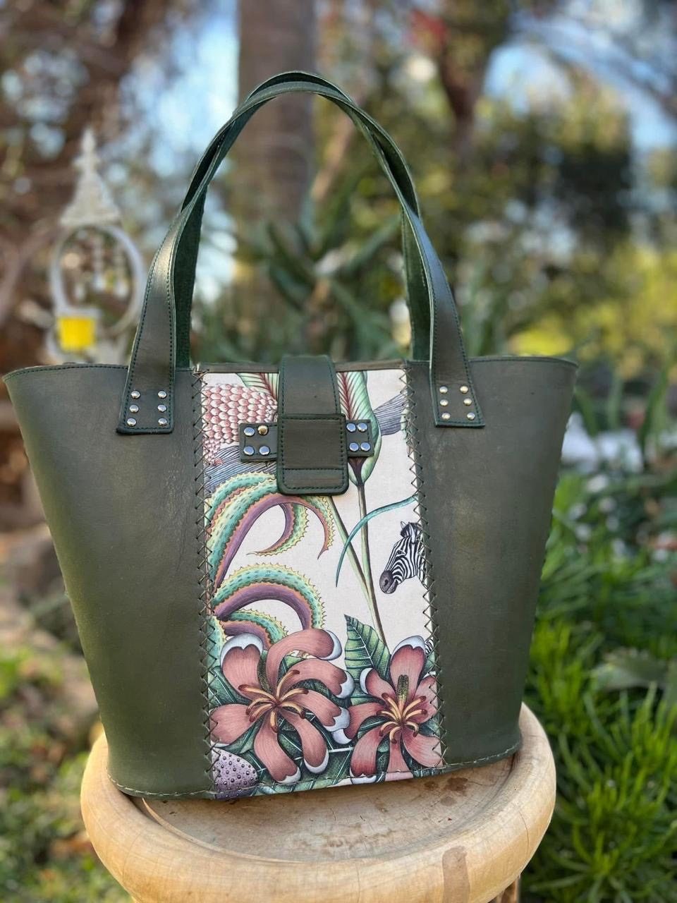 Green leather tote with zebra and floral panel