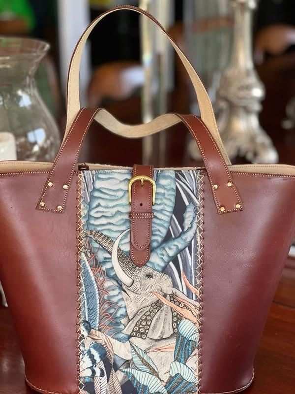 Maroon leather tote with elephant tapestry panel