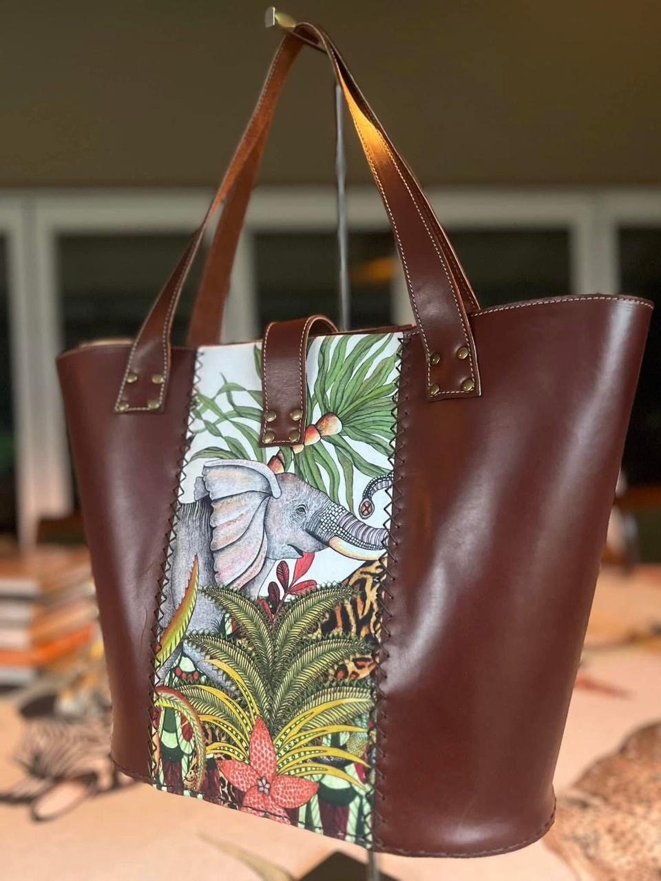 Maroon leather tote with elephant and jungle panel