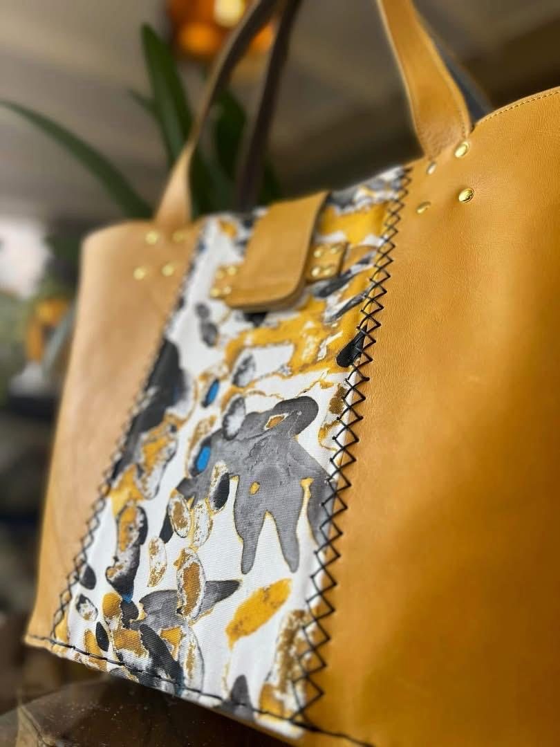 Mustard leather tote with abstract print panel