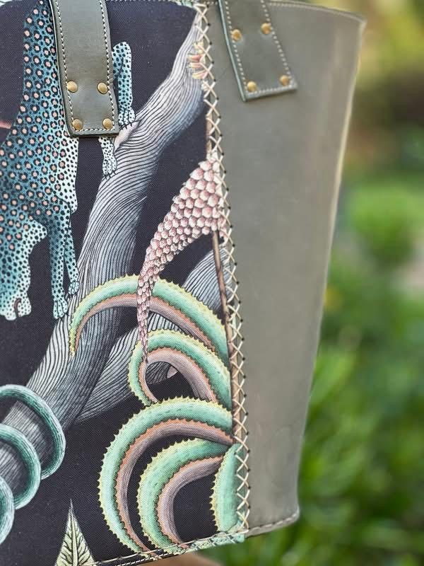 Close-up of a leopard and cactus tapestry panel