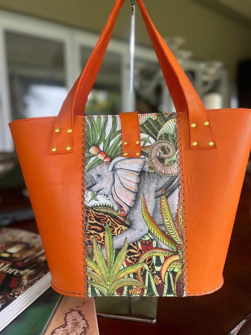 Orange leather tote with elephant panel