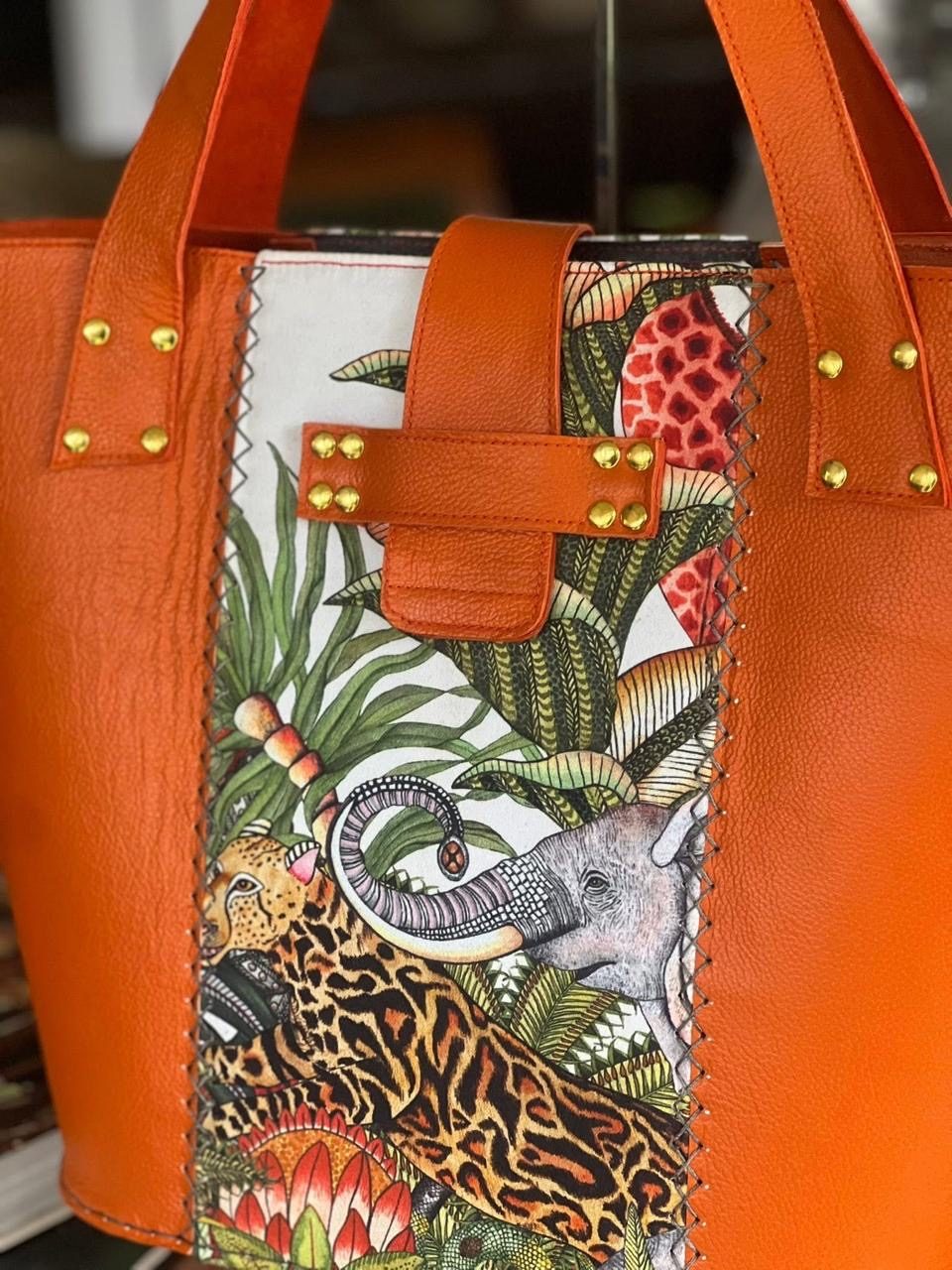 Close-up of a leopard and elephant tapestry panel