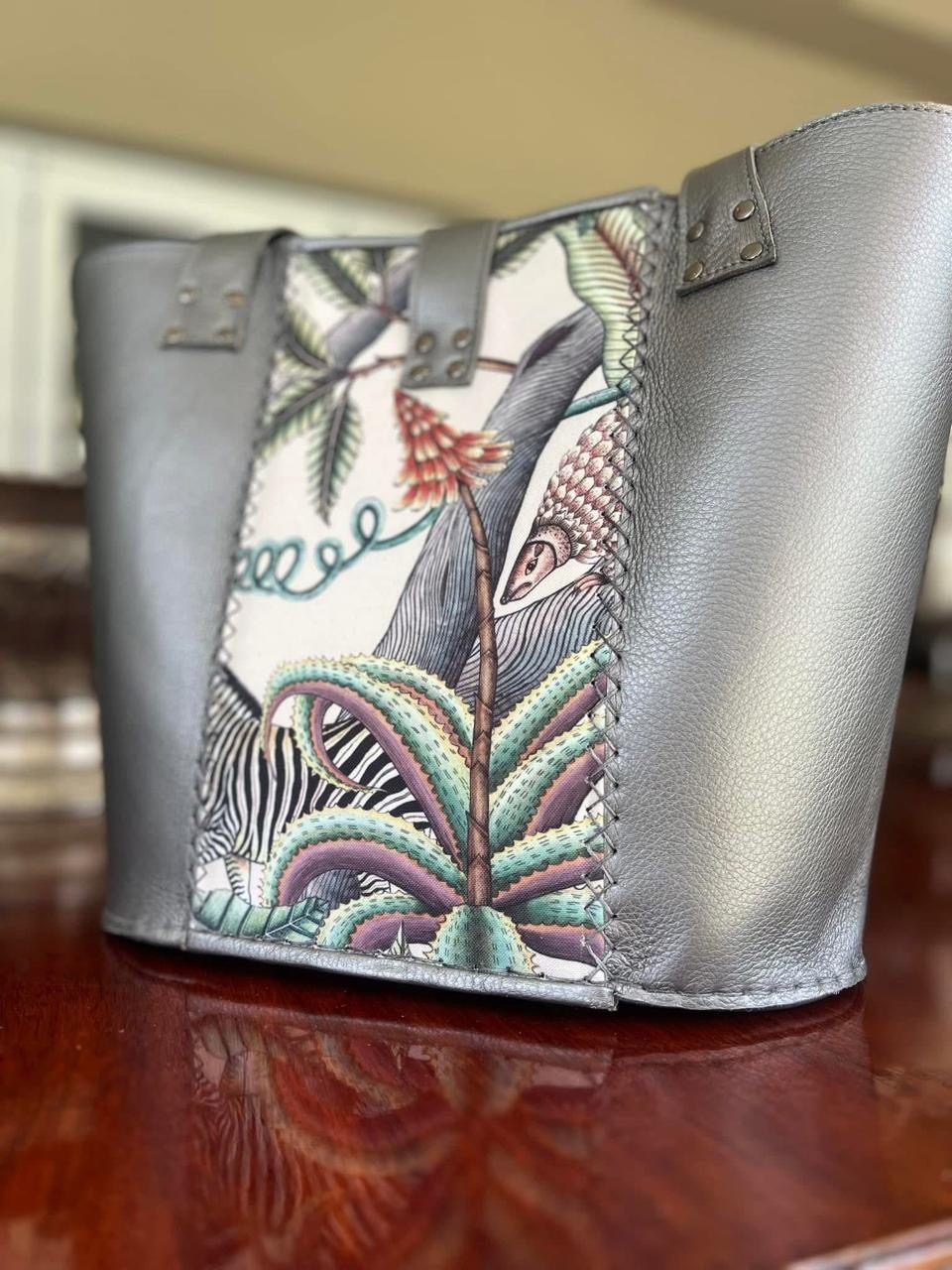Close-up of a zebra and aloe tapestry panel